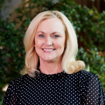 Joan has blonde shoulder length hair