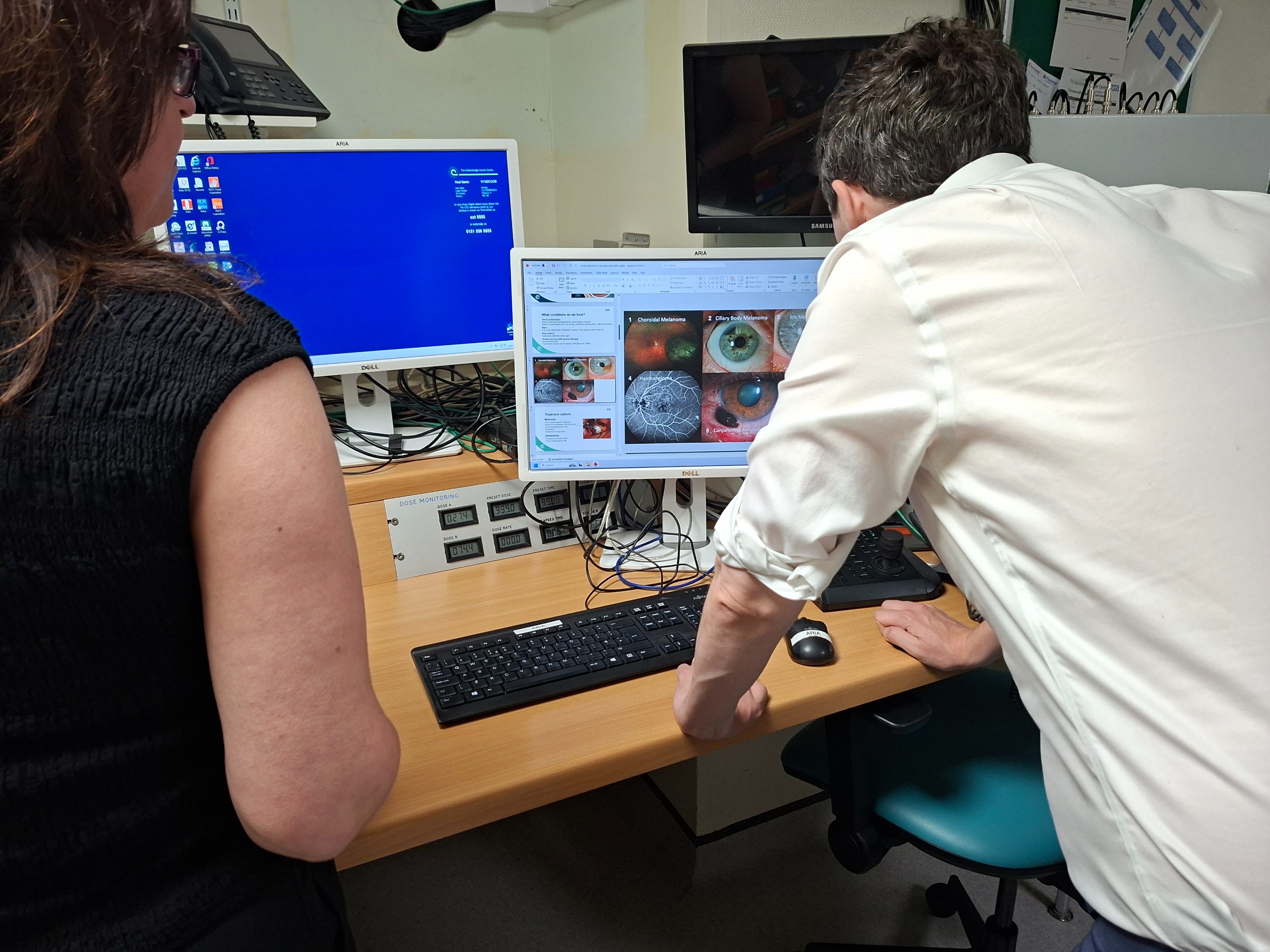 Man looking at a computer screen with close-up images of eyes