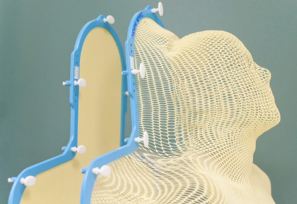 Thermoplastic mask used during radiotherapy is made out of soft plastic and is like mesh with holes so you can breathe throughout. It's attached to a board during treatment to keep the patient still